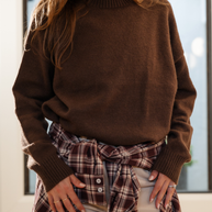 Rich chocolate brown dropped shoulder knit with ribbed neckline and cuffs
