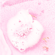 Crystal infused pink bath bomb with rose quartz and gold shimmer