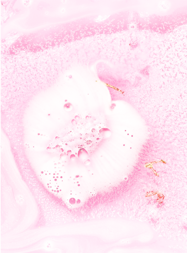 Crystal infused pink bath bomb with rose quartz and gold shimmer
