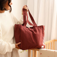 Six pocket cotton canvas tote bag with antique gold hardware
