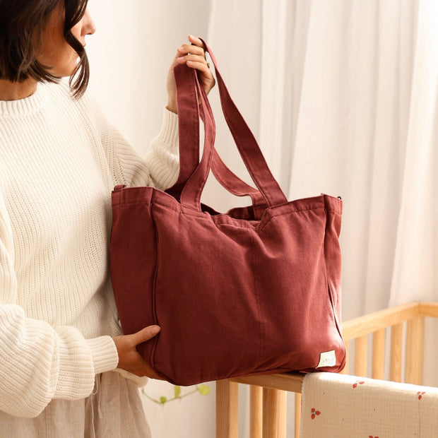 Six pocket cotton canvas tote bag with antique gold hardware
