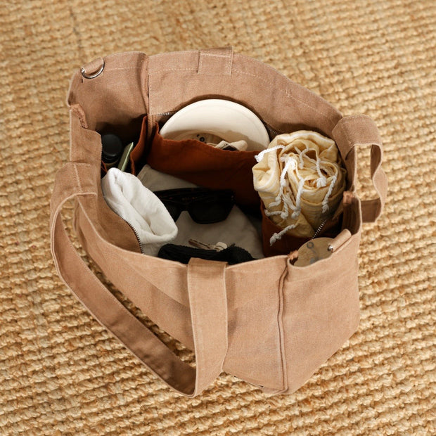Six pocket cotton canvas tote bag with antique gold hardware
