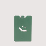Slim reusable ice pack with embossed smiley design