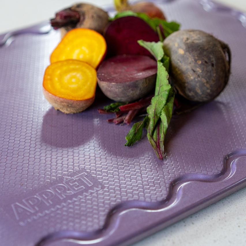 Small lilac chopping board with non-slip grip