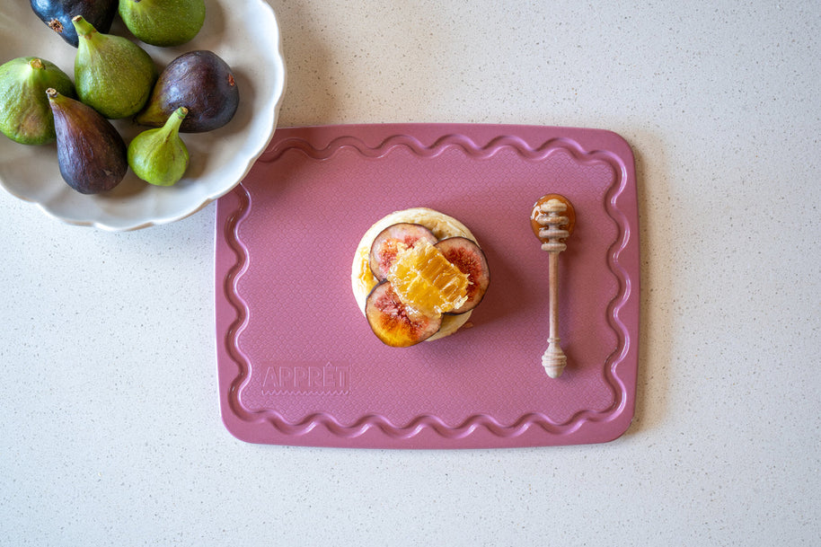 Small pink chopping board with non-slip grip