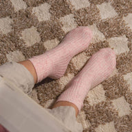 Soft blush pink cosy socks made from responsibly sourced cashmere and recycled fibres