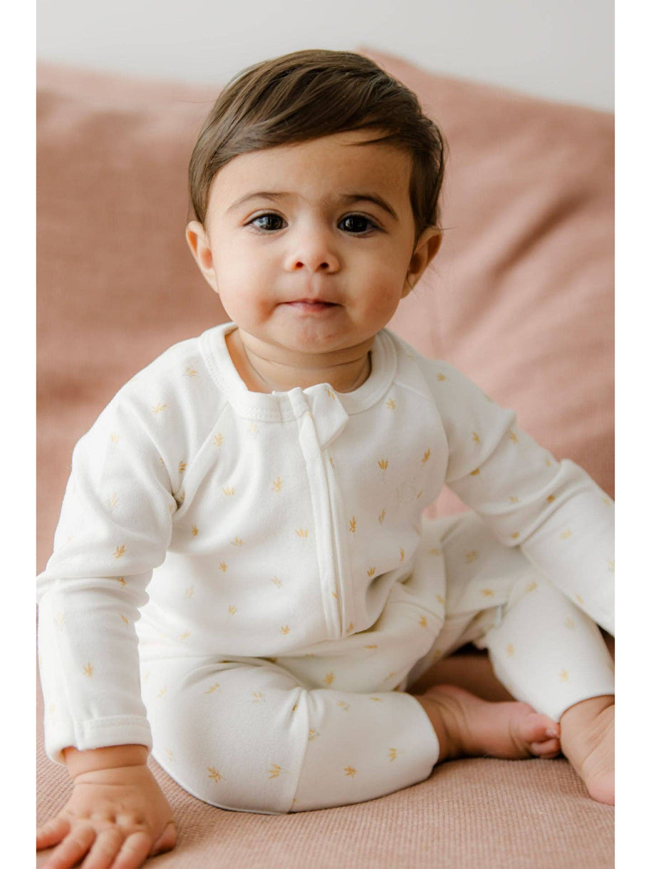 Soft cream cotton baby growsuit with delicate wheat sprig print and fold over cuffs