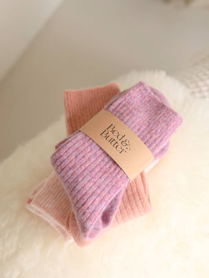 Soft heather rose cosy socks made from responsibly sourced cashmere and recycled fibres