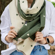 Soft reversible winter scarf with olive and cream heart pattern and frayed edges