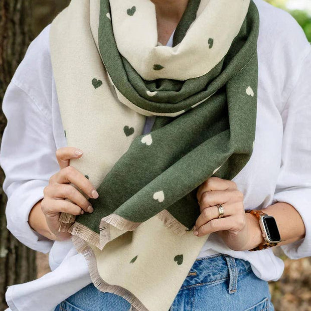 Soft reversible winter scarf with olive and cream heart pattern and frayed edges