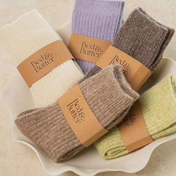 Soft ribbed cream knee high socks made from cashmere and recycled fibres