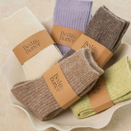 Soft ribbed cream knee high socks made from cashmere and recycled fibres