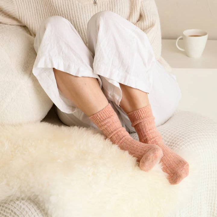 Soft ribbed dusty orange socks made from cashmere and recycled fibres