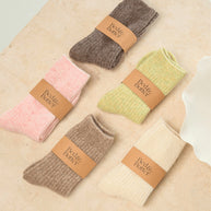 Soft ribbed light sage green socks made from cashmere and recycled fibres