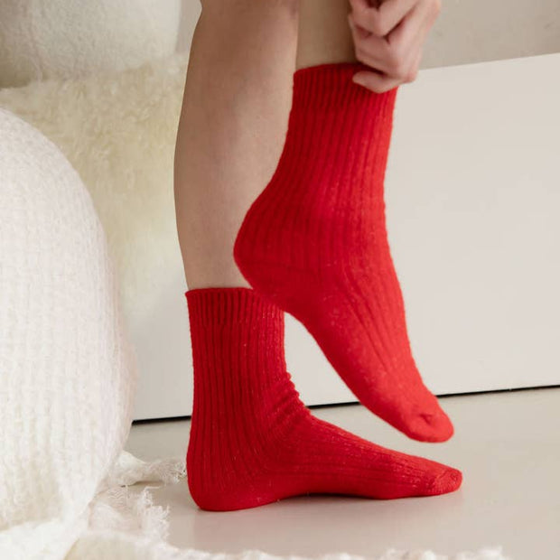 Soft ribbed red socks made from cashmere and recycled fibres