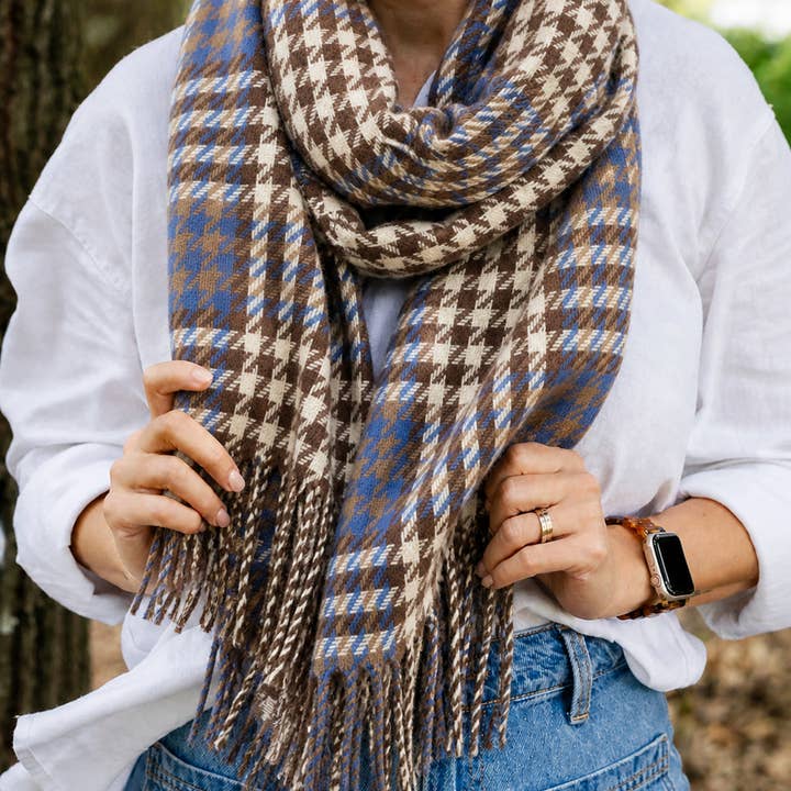 Soft winter-weight houndstooth scarf in blue brown and cream tones with fringe ends