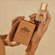 Travel-size perfume bottle with sandalwood and amber notes