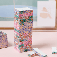 Wooden tumbling tower blocks with a floral design