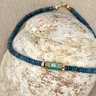 Turquoise necklace with blue enamel evil eye focal bead