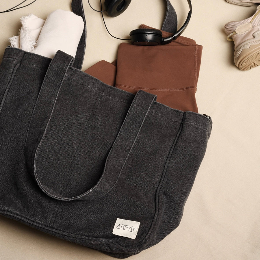 Washed black everyday tote and nappy bag with zip top closure
