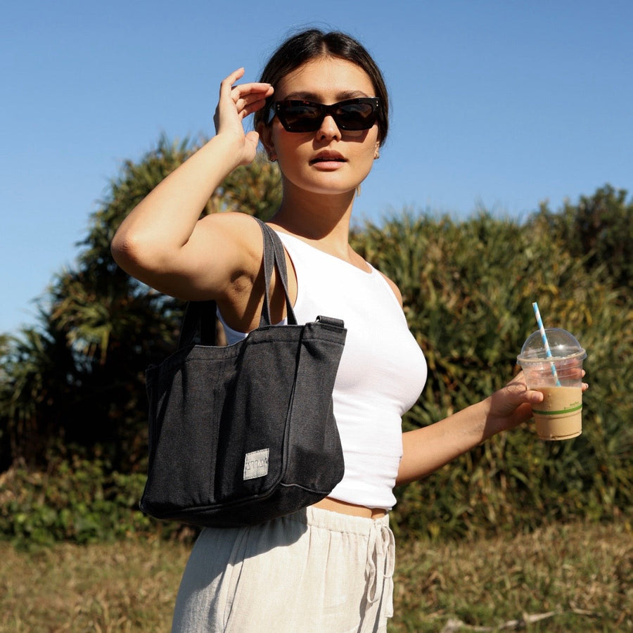 Washed black mini everyday tote with zip top closure and carry handles
