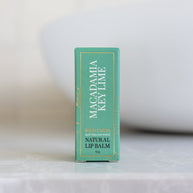 Wild Emery Macadamia Key Lime Natural Lip Balm in eco-friendly cardboard tube