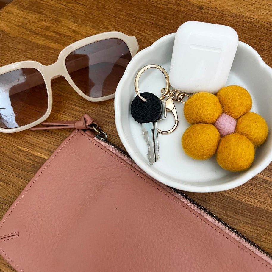 Yellow Felt Flower Keychain attached to bag