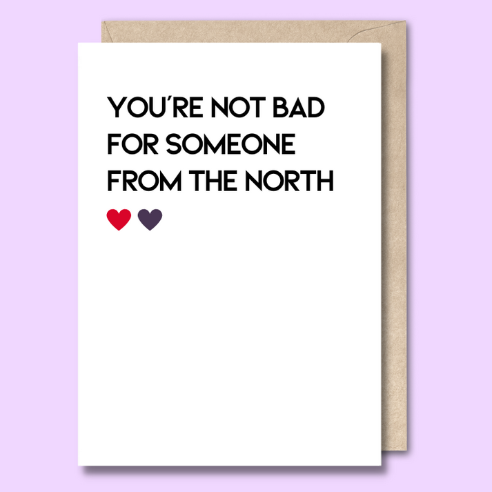Unseasoned Greetings You’re Not Bad for Someone from the North card with red and purple hearts