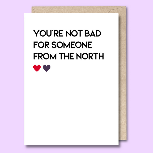 Unseasoned Greetings You’re Not Bad for Someone from the North card with red and purple hearts