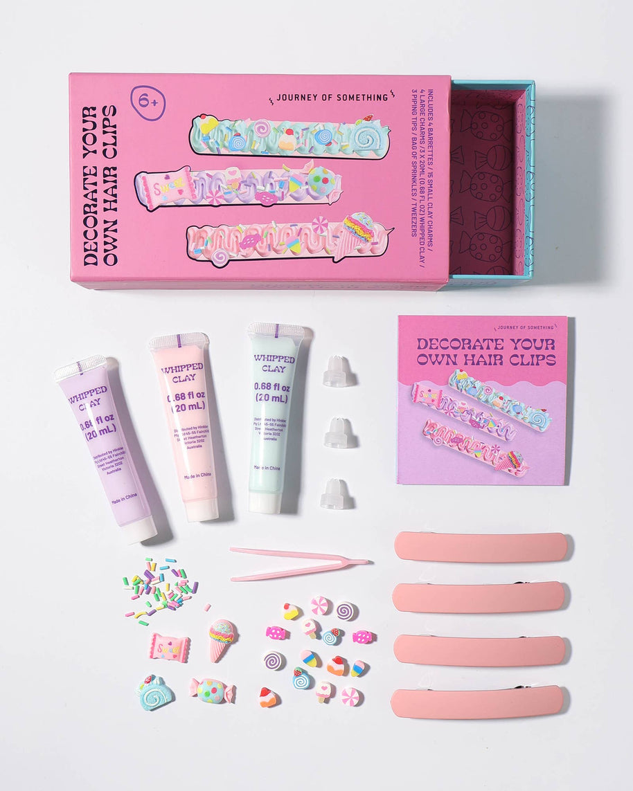Kids craft kit contents: hair clips, clay charms, piping tips and sprinkles