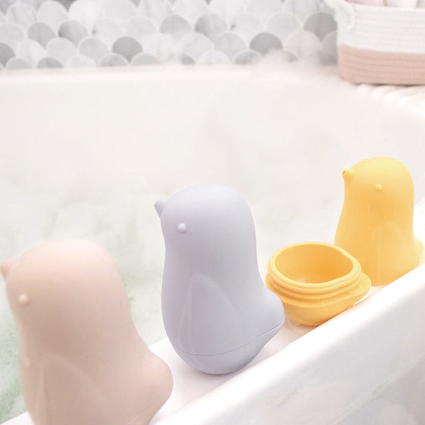 Silicone squeezy bird bath toys that open for easy cleaning