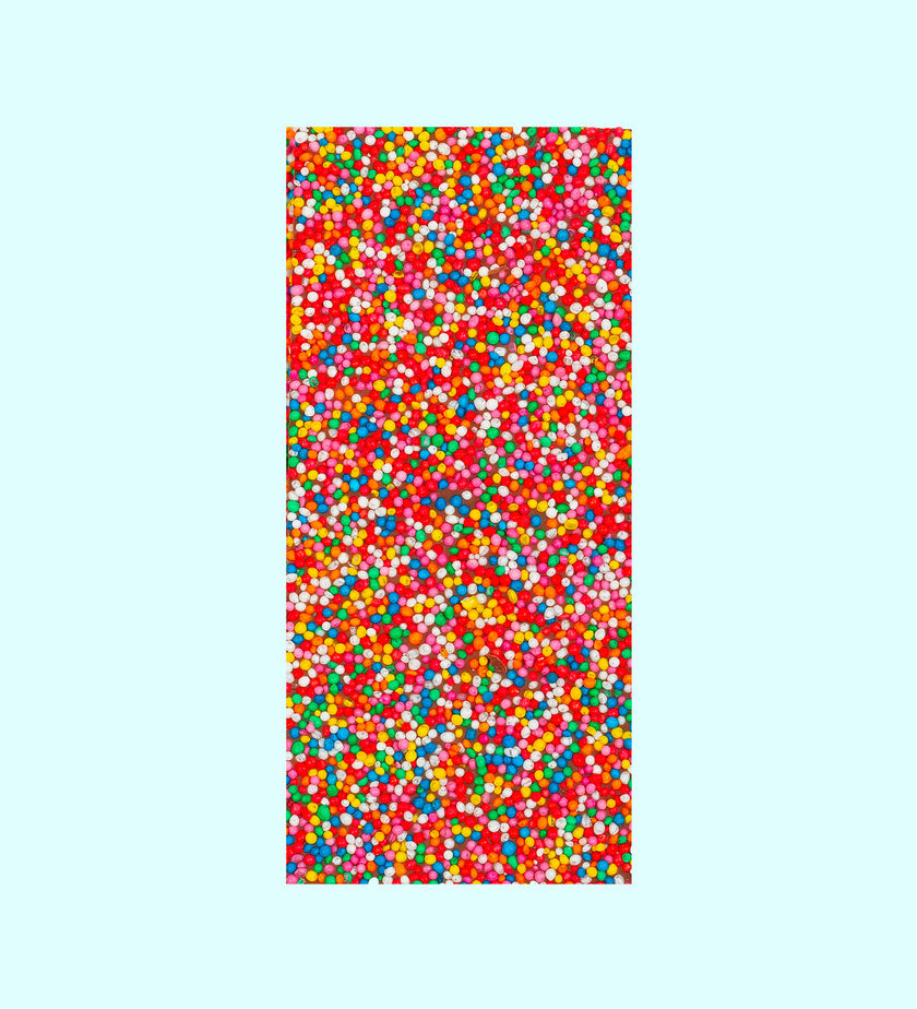 Handmade Belgian milk chocolate block topped with rainbow sprinkles