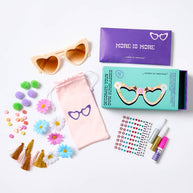 DIY sunglasses kit with pom poms, tassels, glitter glue and gem stickers