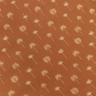 Soft organic cotton cot sheet in bronze palm tree print