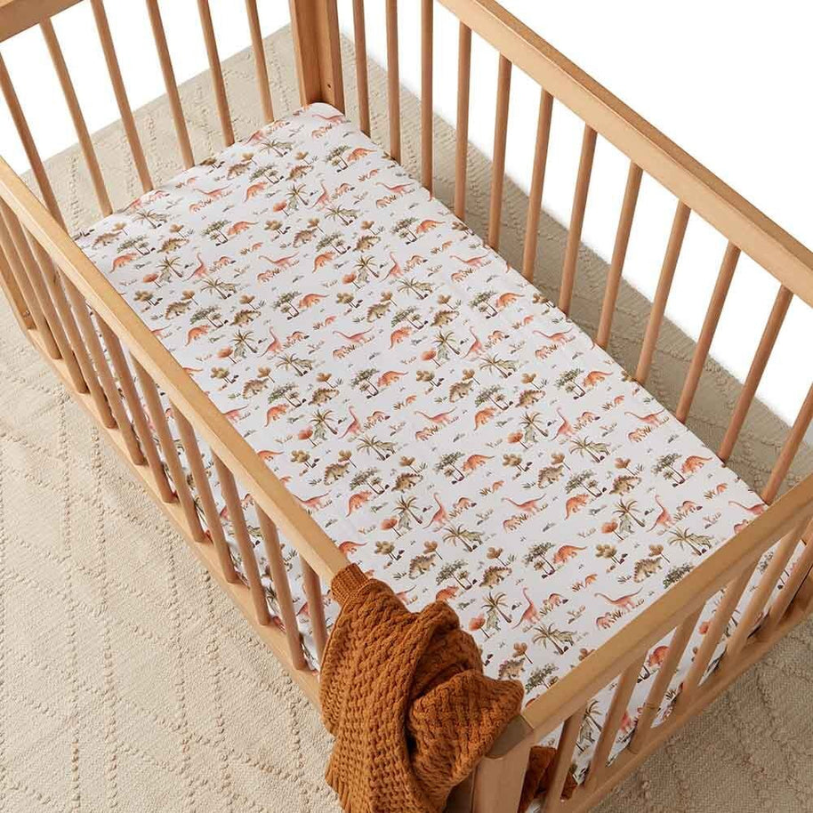 Soft organic cotton baby cot sheet featuring dinosaur print