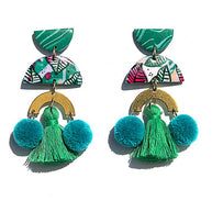 Hand-painted statement earrings with pom poms and gold accents