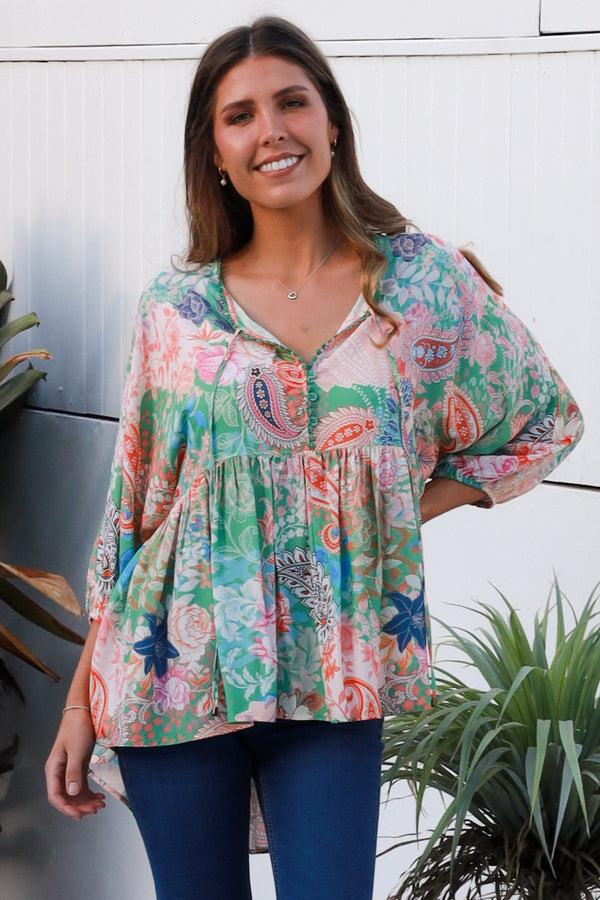 Model wearing the DreamCatcher Bohemian Top in a colourful floral and paisley print with a loose, flowy fit.