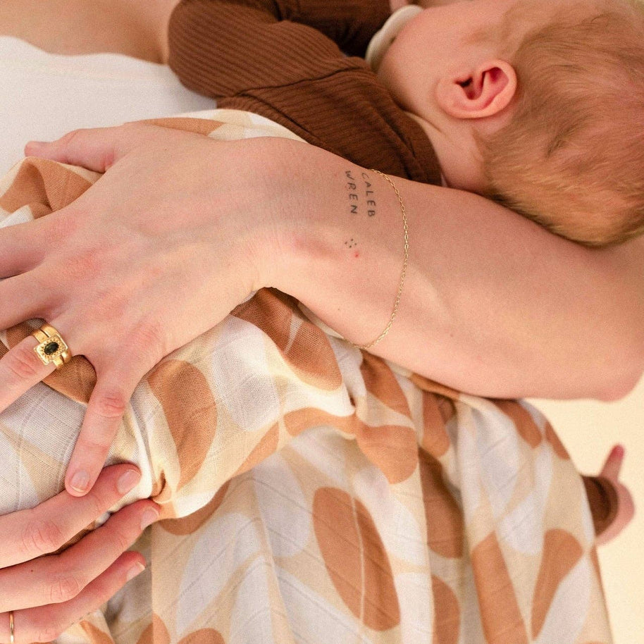 Baby swaddle in earthy neutral Pebble pattern