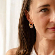 Gold hoop earrings with removable pink rose quartz stone