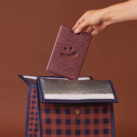 Slim reusable ice pack with embossed smiley design