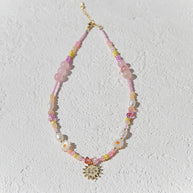 Handmade beaded necklace in peach and gold tones