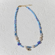 Adjustable beaded necklace with gold evil eye charm by Kingston Jewellery