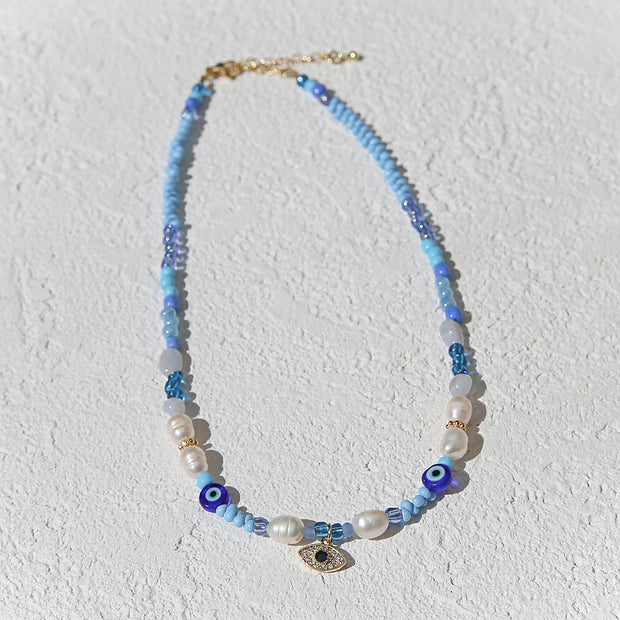 Adjustable beaded necklace with gold evil eye charm by Kingston Jewellery