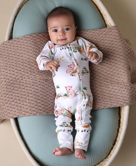 Soft zip-up organic cotton romper with foldover feet and Farm print