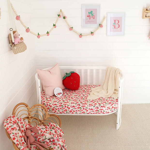 Snuggle Hunny organic cotton cot sheet with strawberry print