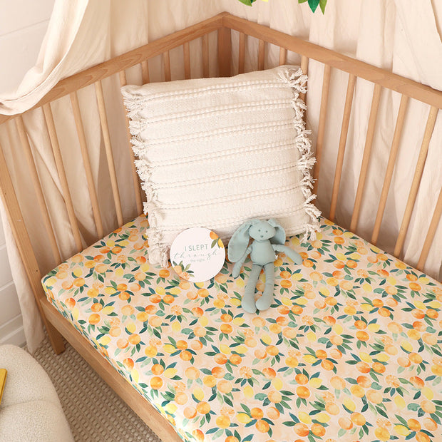 Snuggle Hunny Sunny Citrus Organic Fitted Cot Sheet on cot mattress